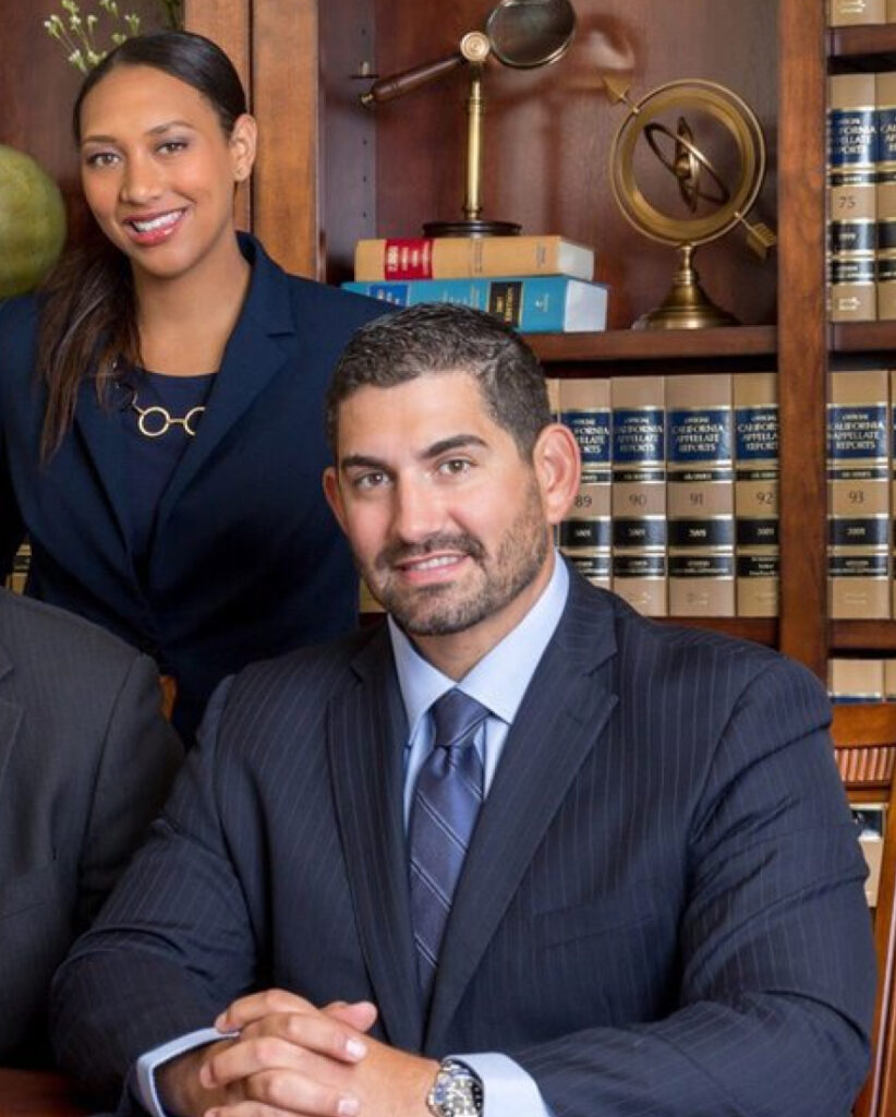 A photo of Adam Ferguson sitting down along with a colleague